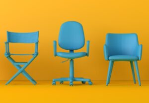 Three different blue chairs including director's chair, office chair, and armchair on yellow background representing different e-commerce approaches