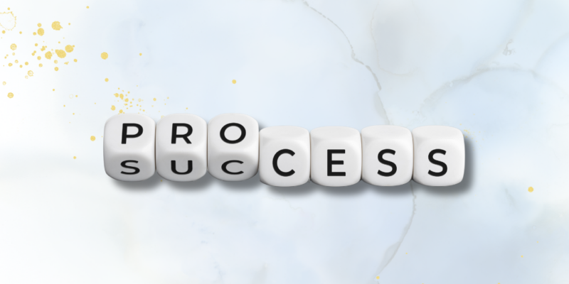 An image with the word success shown on a light cloudy blue background.