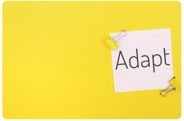 Yellow background with the word Adapt appearing like a post it note.