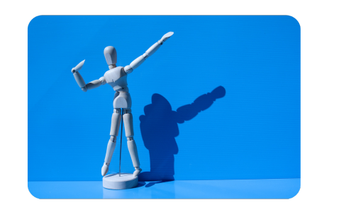 Wooden mannequin striking a pose symbolizing performance and positioning