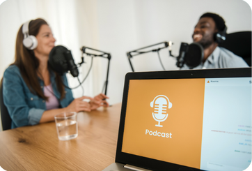 Podcast hosts recording an episode, illustrating how creator relationships protect podcast advertising performance