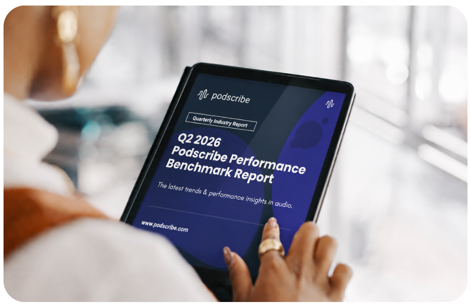 Person viewing the Q2 2026 Podscribe Performance Benchmark Report on a tablet screen.