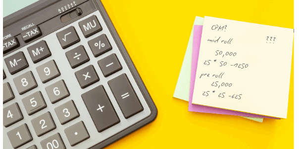 lose-up of a calculator and colorful sticky notes with CPM math for podcast advertising, calculating mid-roll and pre-roll ad costs on a bright yellow background