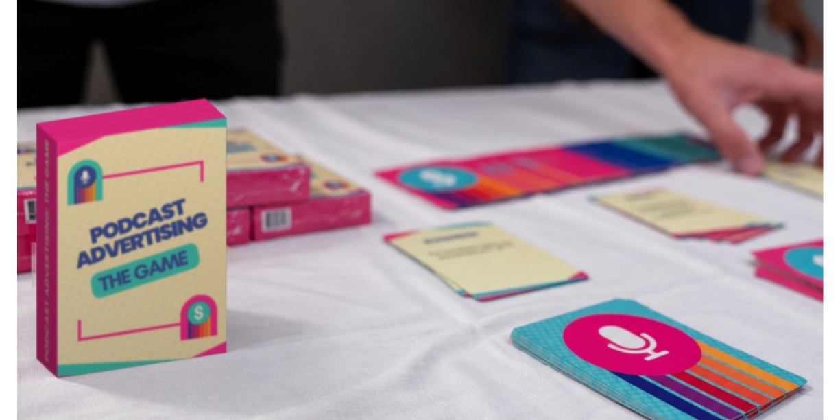 Podcast Advertising: The Game card box standing on a table with game cards at the Sounds Profitable Podcast Business Summit