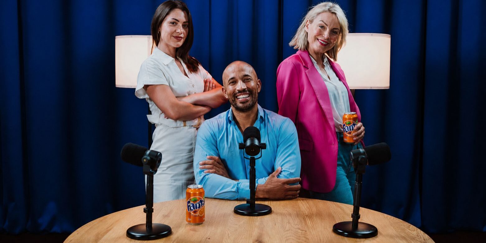 an example of a brand integration in a podcast with hosts displaying cans of soda